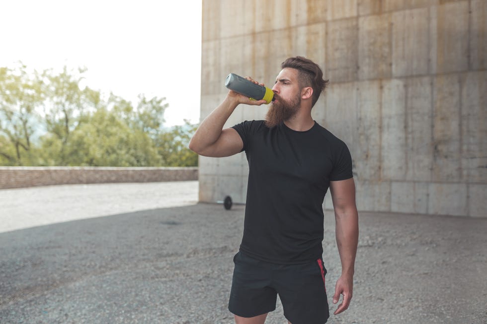 athlete resting after running stock photo